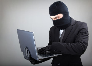 bigstock-Computer-Hacker-in-suit-and-ti-31750772